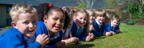 Pupils laying on the grass